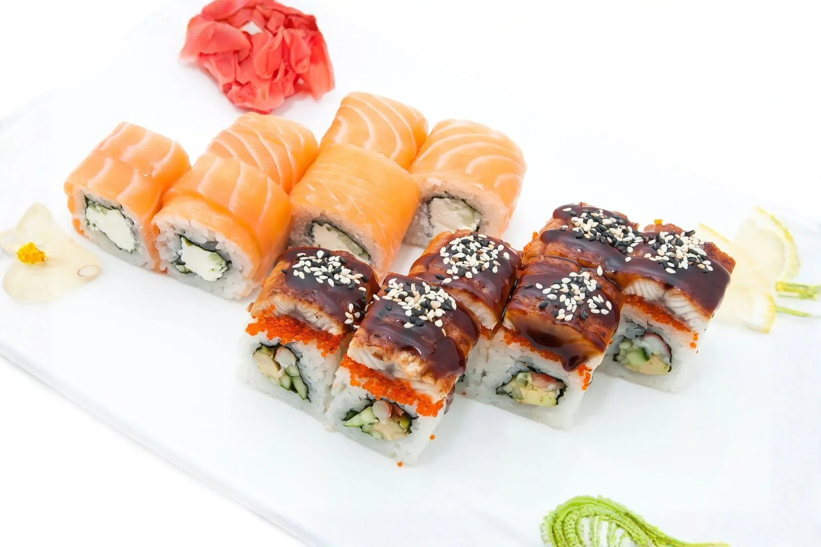 Two types of specialty sushi rolls with eel, salmon, tobiko and sesame seeds at SUSHI 88, a Japanese Restaurant in New York